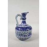 A Chinese blue and white porcelain pourer with a ribbed body, with scrolling lotus flower