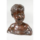 A filled copper bust of a young child, signed Donatello, 13" high