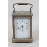 A plated brass cased carriage clock with white enamel dial and Roman numerals, 5½" high