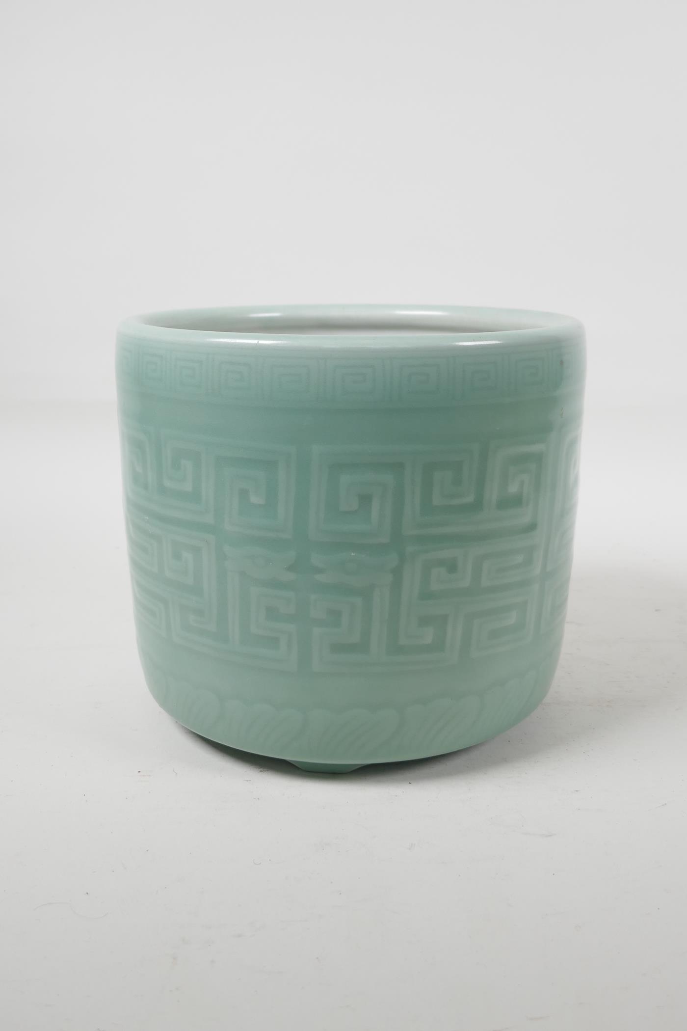 A celadon glazed porcelain brush pot with archaic style underglaze decoration, Chinese, 6½" high x