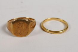 A 22ct gold wedding band, 2.8g, size L/M and an 18ct gold signet ring, 7.3g, size O/P