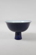 A Chinese powder blue glazed porcelain stem bowl, six character mark to bowl, 4½" high, 7" diameter