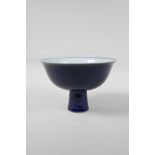 A Chinese powder blue glazed porcelain stem bowl, six character mark to bowl, 4½" high, 7" diameter