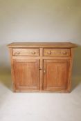 A C19th pine buffet of two drawers over two cupboards, 52" x 21", 39" high