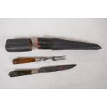 An antique continental travelling knife and fork set with agate handles, in a shagreen case, 8½"