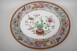 A Staffordshire meat plate decorated in the oriental manner in bright enamels, 20½"  x 17"