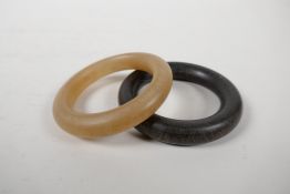 A faux horn bangle, and another darker, 3½" diameter
