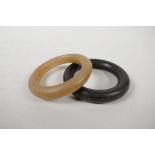 A faux horn bangle, and another darker, 3½" diameter