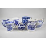 A collection of early C19th blue and white pottery mugs, jugs and small teapot