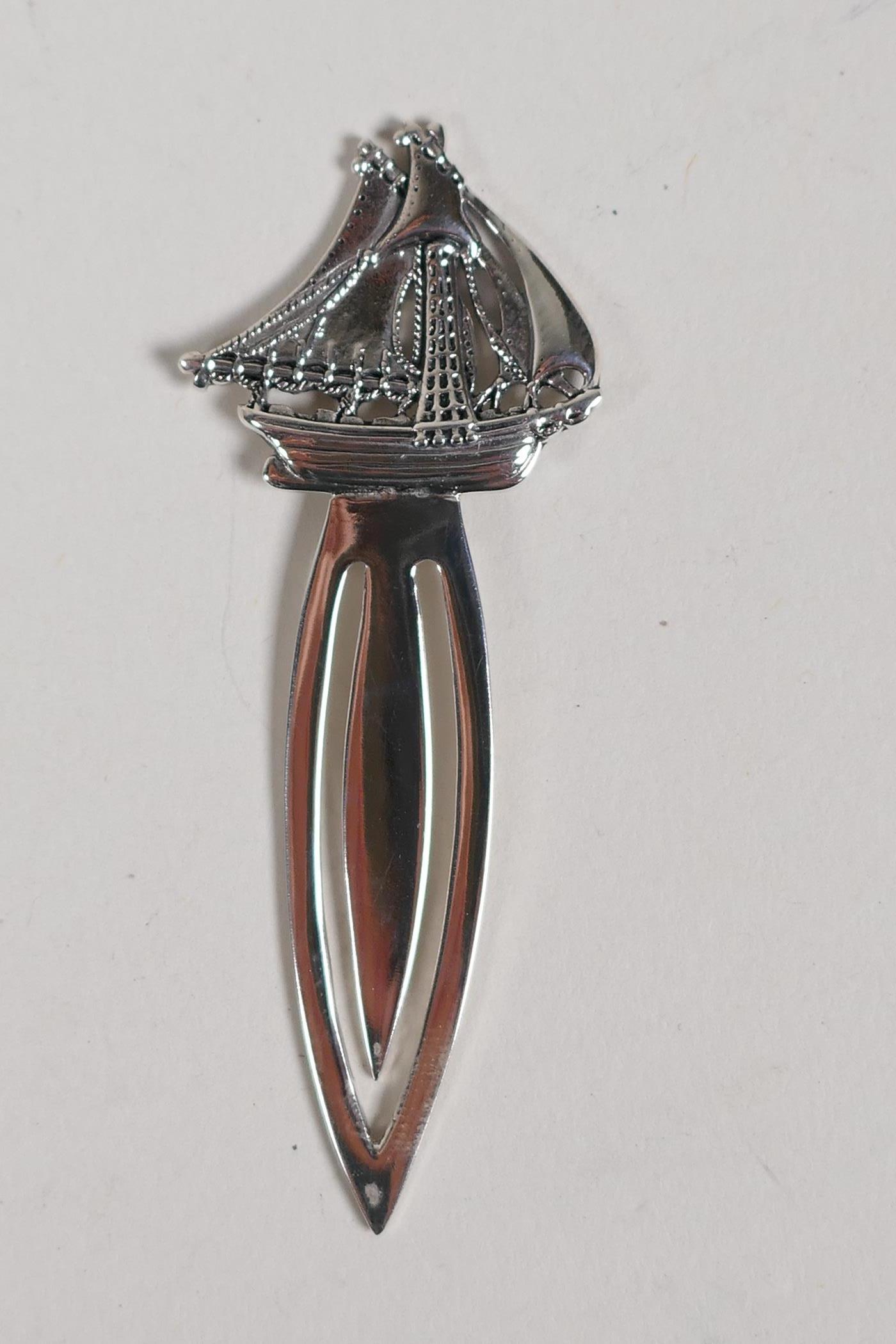 A sterling silver bookmark with a sailing boat finial, 2" long