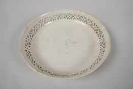 A late C18th creamware shallow bowl with pierced rim, 8" diameter