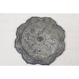 A Chinese Tang style bronze mirror, the back cast with birds and flowers, 8" diameter
