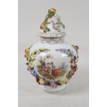 A German porcelain vase and cover, decorated with a courting couple, and encrusted with fruit and