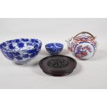 Three pieces of oriental porcelain to include an Imari palette tea pot, and two black and white