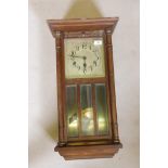 An early C20th mahogany cased wall clock with Westminster chime movement, silvered dial and arabic