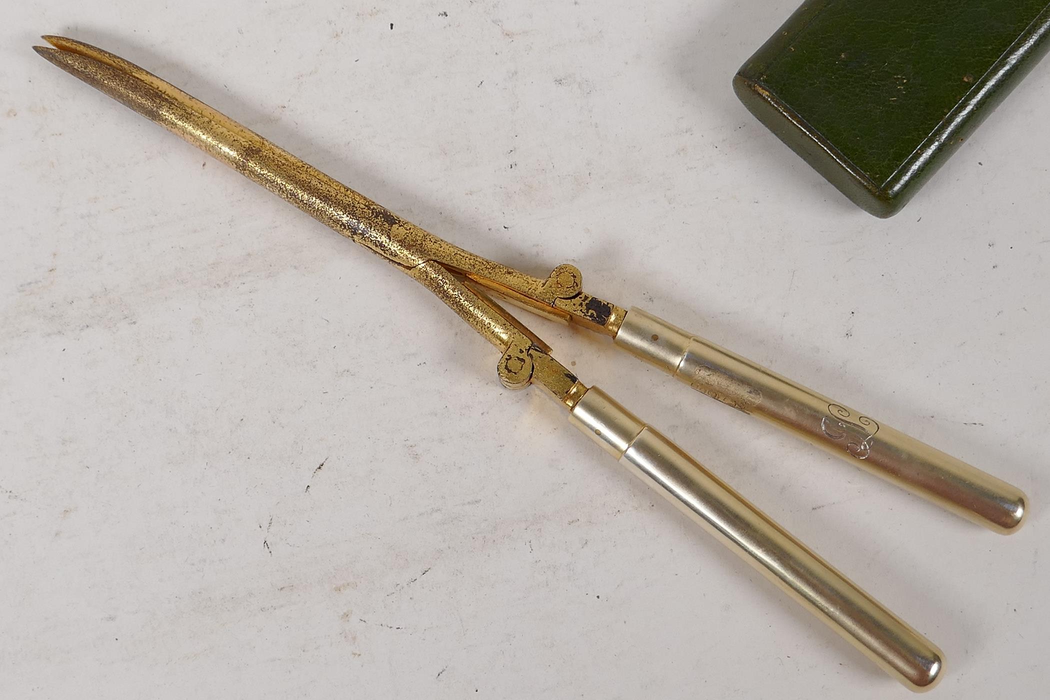 A pair of gilt metal folding curling tongs with hallmarked silver handles, London 1905, in a - Image 2 of 6