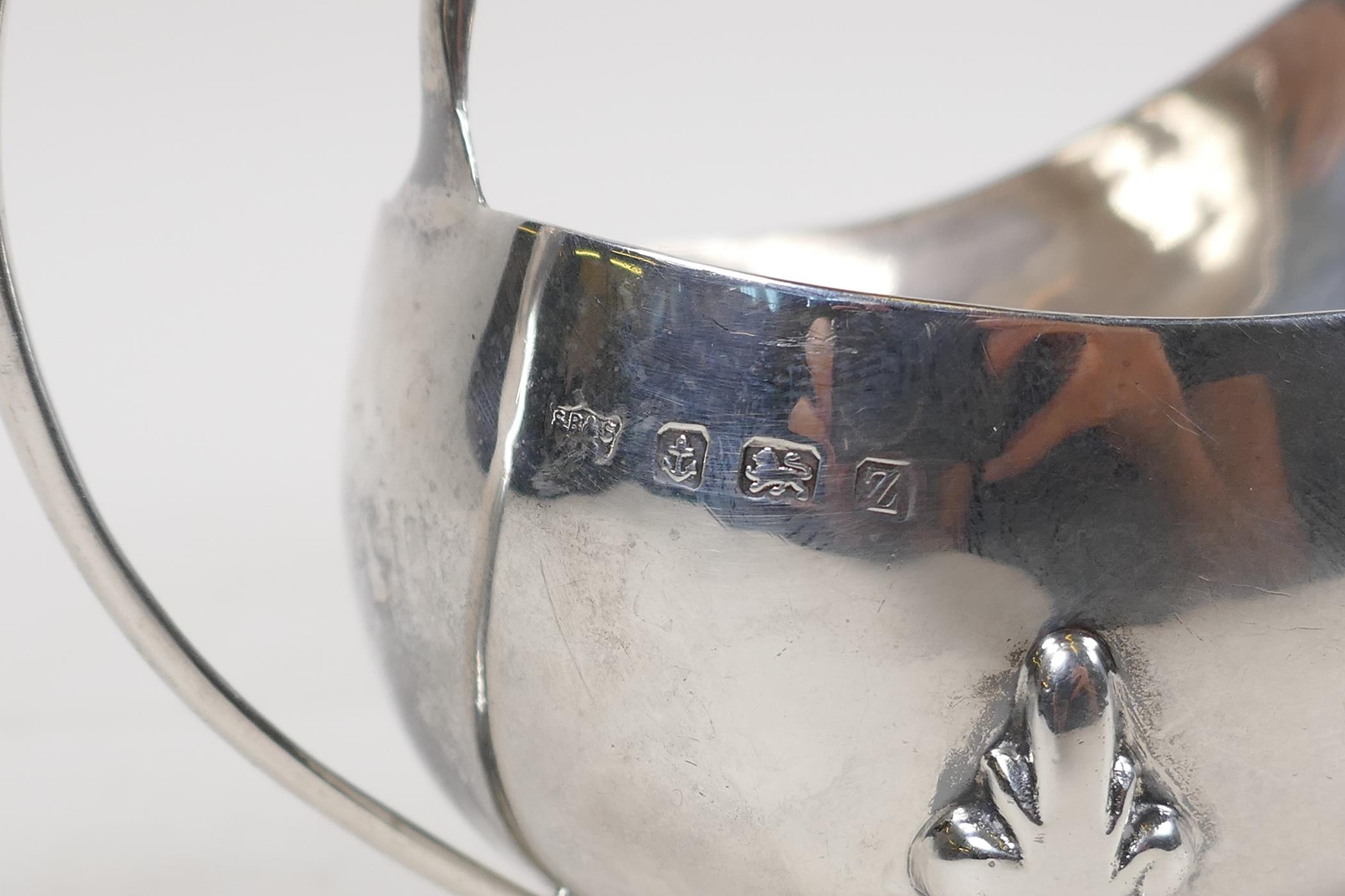 A hallmarked silver sauce boat, Birmingham 1924, and a silver mustard pot with blue glass liner, - Image 3 of 6