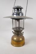 A German Petromex 826 brass and glass parafin lamp with chrome plated shade, 16½" high