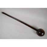 An antique ethnic hardwood club, 23" long