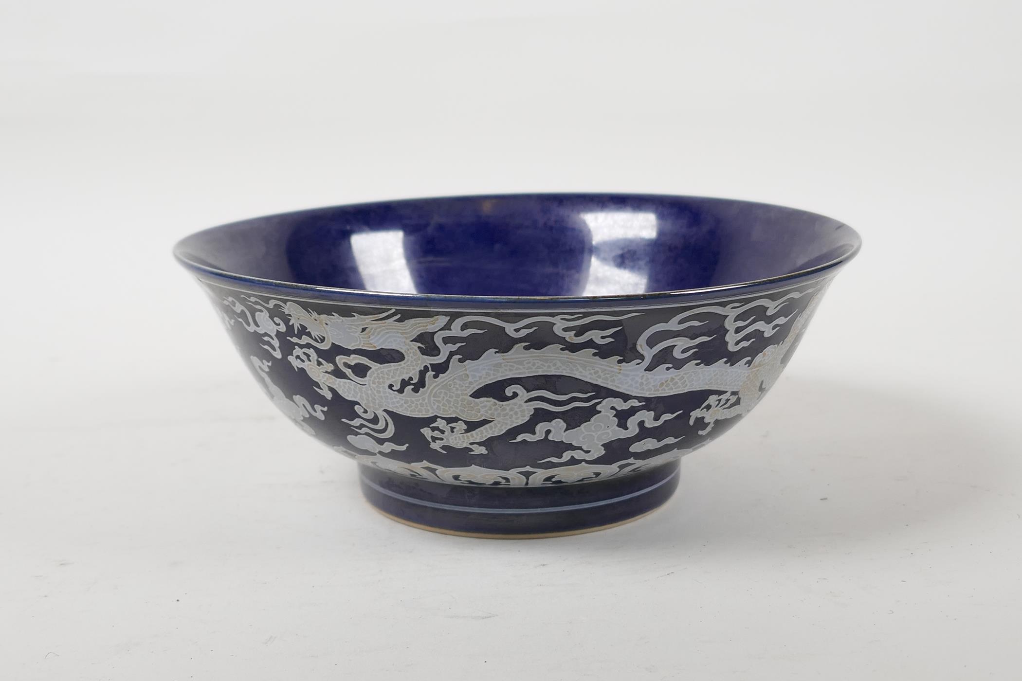 A powder blue glazed porcelain rice bowl with white enamel dragon decoration, six character mark - Image 2 of 6