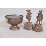 A C19th French hammered copper pedestal bowl with lion mask handles and inset plaques of French