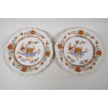 A pair of antique tin glazed Fayence plates, decorated with floral sprays, 1 A/F, 9" diameter