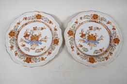 A pair of antique tin glazed Fayence plates, decorated with floral sprays, 1 A/F, 9" diameter