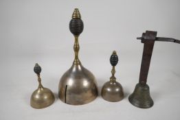 Three early tuned hand bells, 11" high, and a C19th French brass shop bell