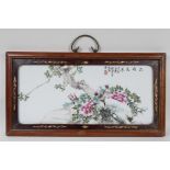 A republic period polychrome panel depicting birds and flowers, in an inlaid hardwood frame,