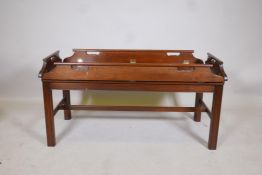 A Georgian style mahogany butlers tray and stand, with brass hinges, 42" x 19" x 21" high
