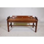 A Georgian style mahogany butlers tray and stand, with brass hinges, 42" x 19" x 21" high