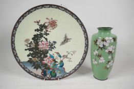 A Chinese cloisonne charger decorated with butterflies and flowers, 12" wide, and a cloisonne vase
