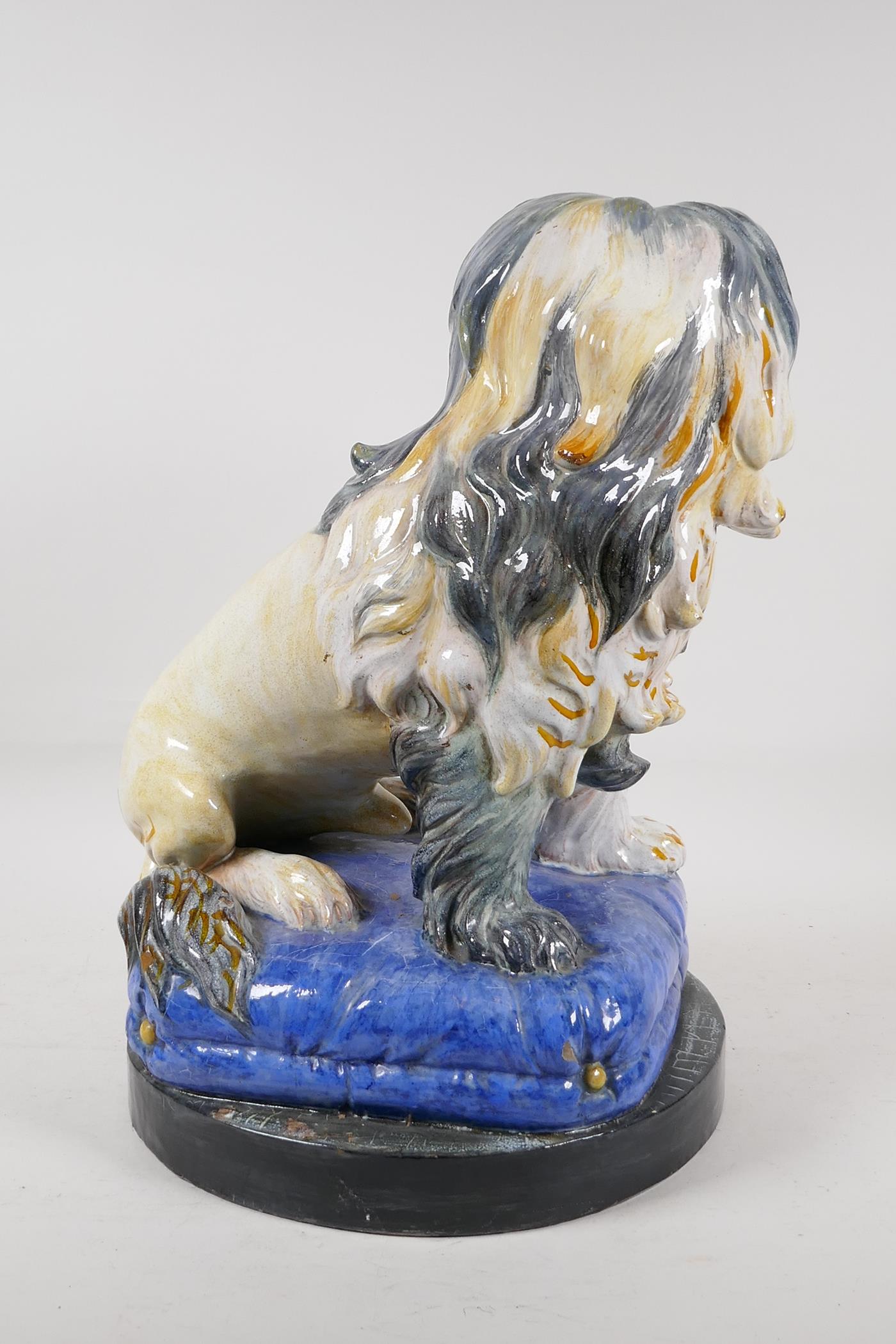 A Majolica pottery dog on a blue pillow, 16" high - Image 4 of 5