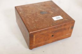 An early C20th French inlaid yew wood musical box, playing two airs, A/F lacks one foot, 7½" x 7½" x