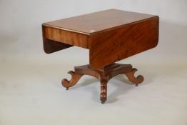 A C19th Continental mahogany sofa table with single end frieze drawer, raised on a square column and