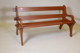 A hardwood slatted garden bench, labelled Branson, England, 58" long