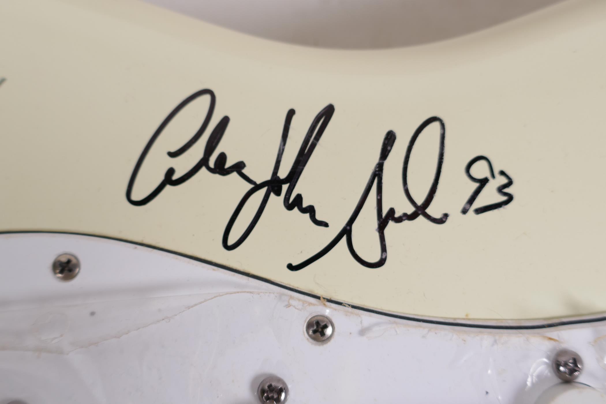 An unused Fender Stratocaster guitar bearing signatures from the band Bon Jovi, 39" long - Image 6 of 6