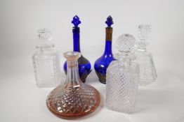 Two good quality cut glass spirit decanters, and four others, tallest 12"