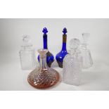 Two good quality cut glass spirit decanters, and four others, tallest 12"