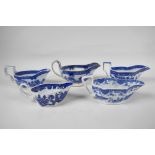 Five late C18th/early C19th English blue and white pottery sauce boats to include Boy on a Buffalo