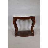 A C19th mahogany serpentine front console table, with marble top raised on shaped and pierced scroll
