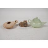 A Chinese carved green jade squat form teapot, Roman terracotta oil lamp, and a carved soapstone