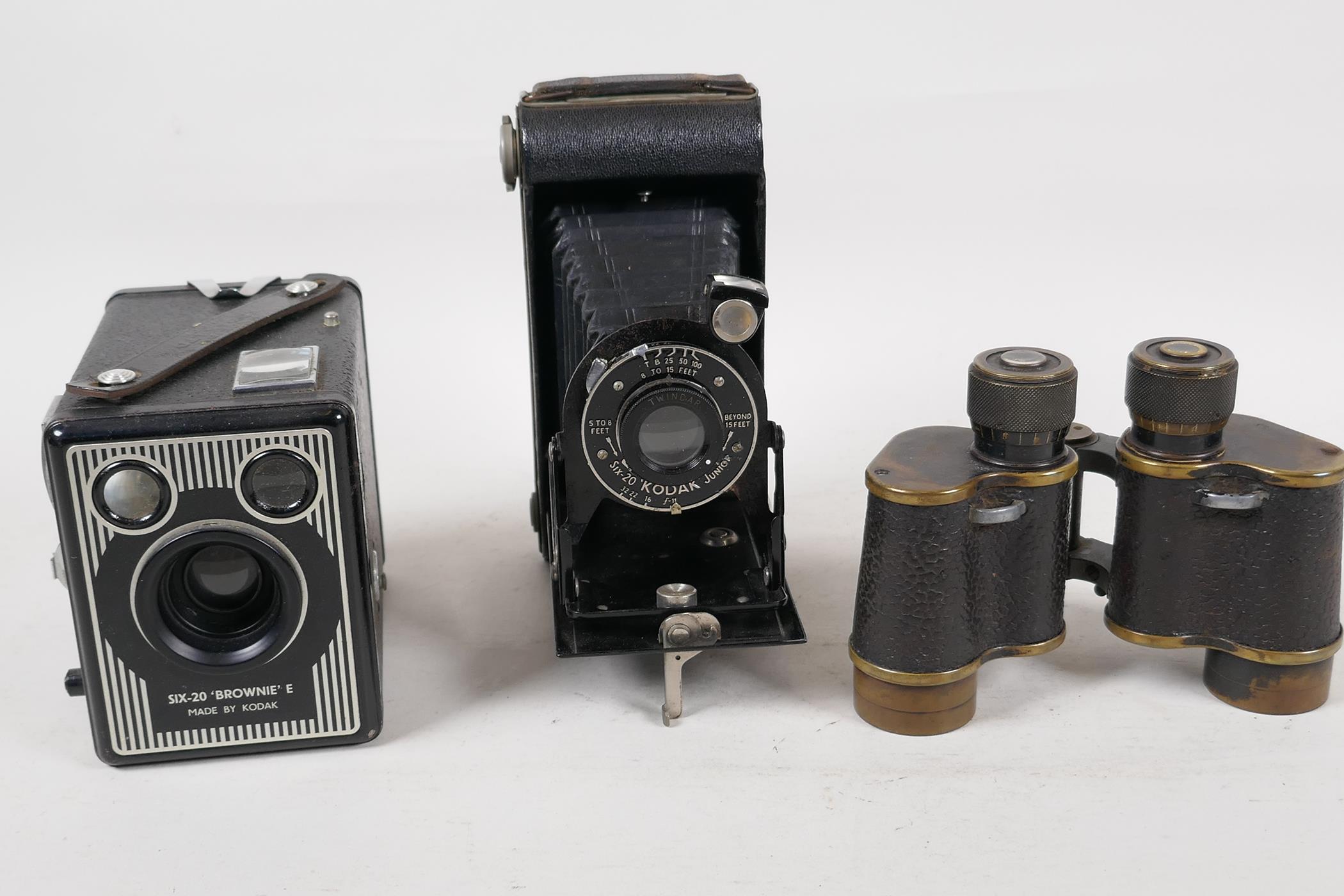 A pair of WWI field glasses, marked S1 No2160 1915, 4" long, together with a Kodak 'Brownie' E Box