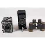 A pair of WWI field glasses, marked S1 No2160 1915, 4" long, together with a Kodak 'Brownie' E Box