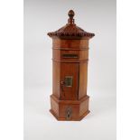 A fruitwood table post box in the form of a Chinese pagoda, with single drawer to base, 21" high