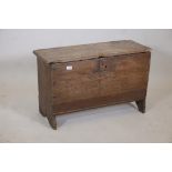 An early C18th oak planked coffer of small proportions, 33" x 13" x 21"