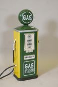 A child's 'gas' pump in racing green and yellow, 31½" high