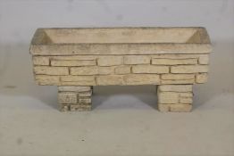 A reconstituted stone planter moulded as Cotswold stone, 30" x 10"