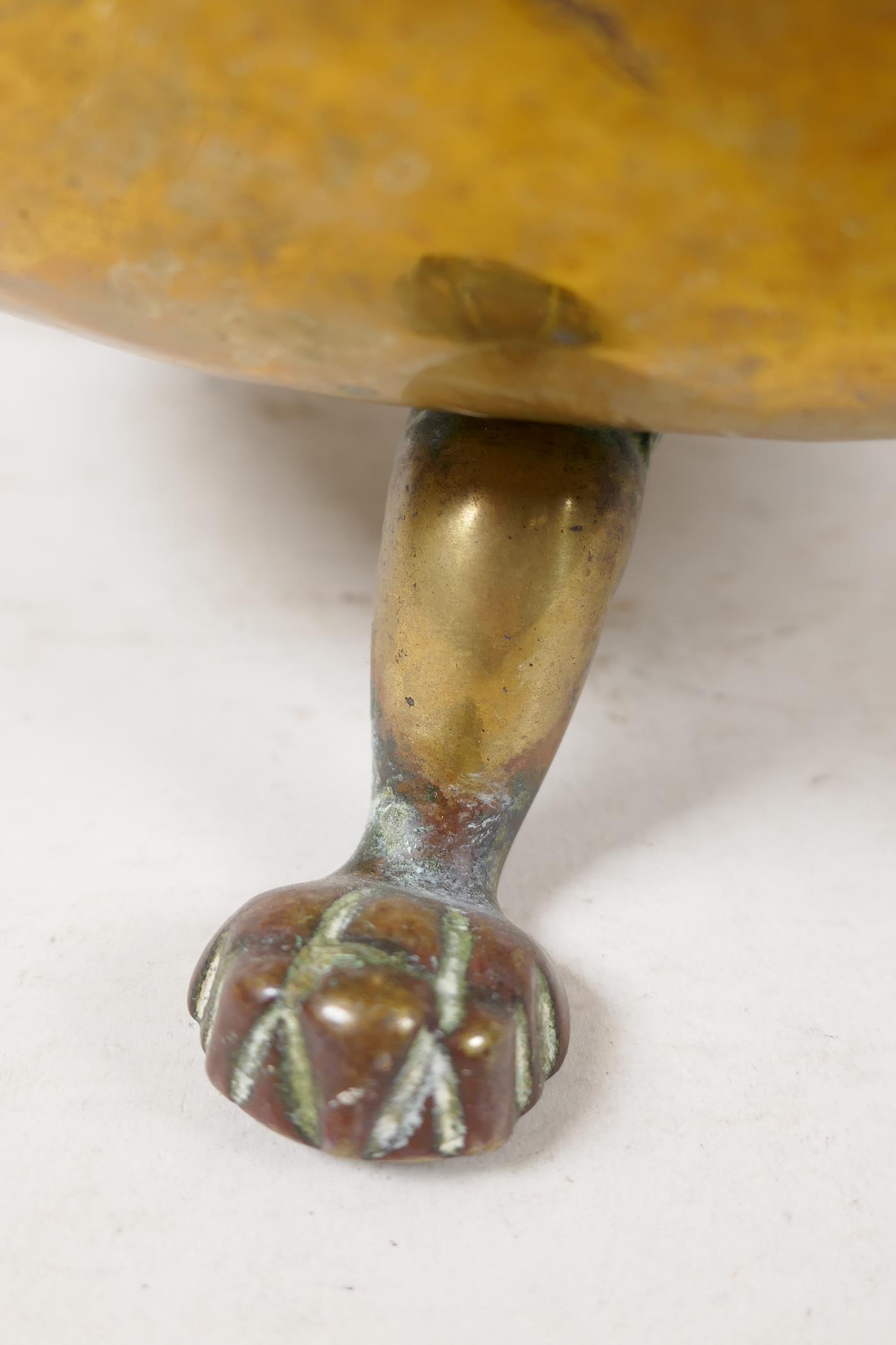 A C19th polished brass jardiniere with lion mask handles and three paw feet, 9" high - Image 4 of 4