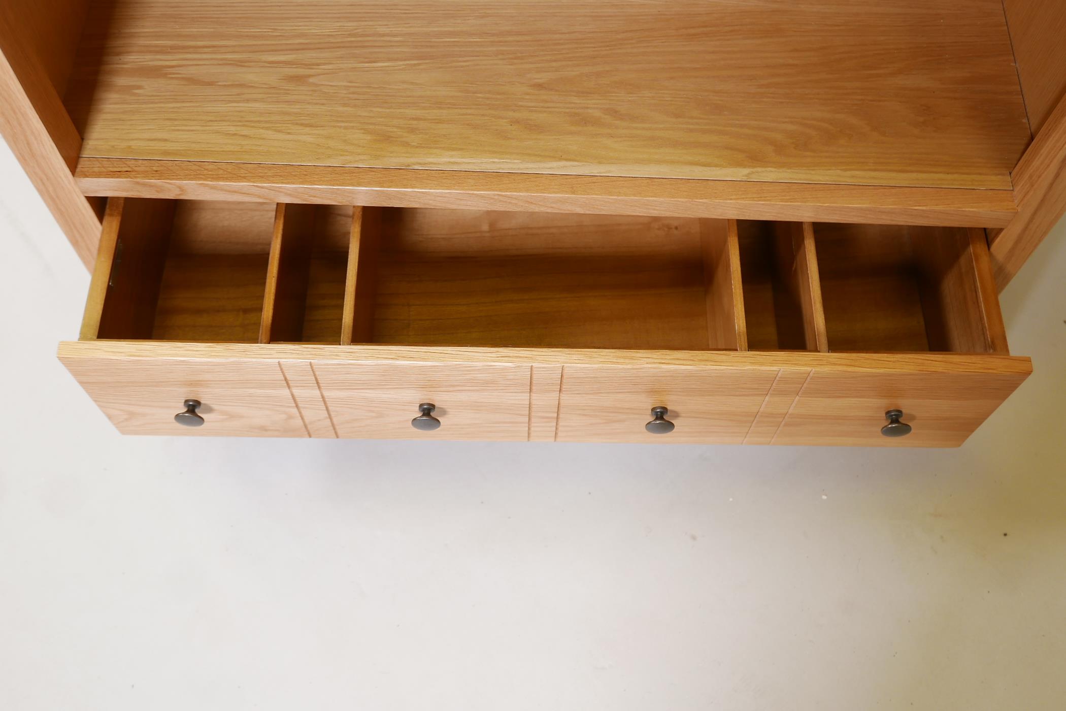 A blonde oak open shelf bookcase, with four shelves and draw to base, supplied by John Lewis, 73" - Image 3 of 3